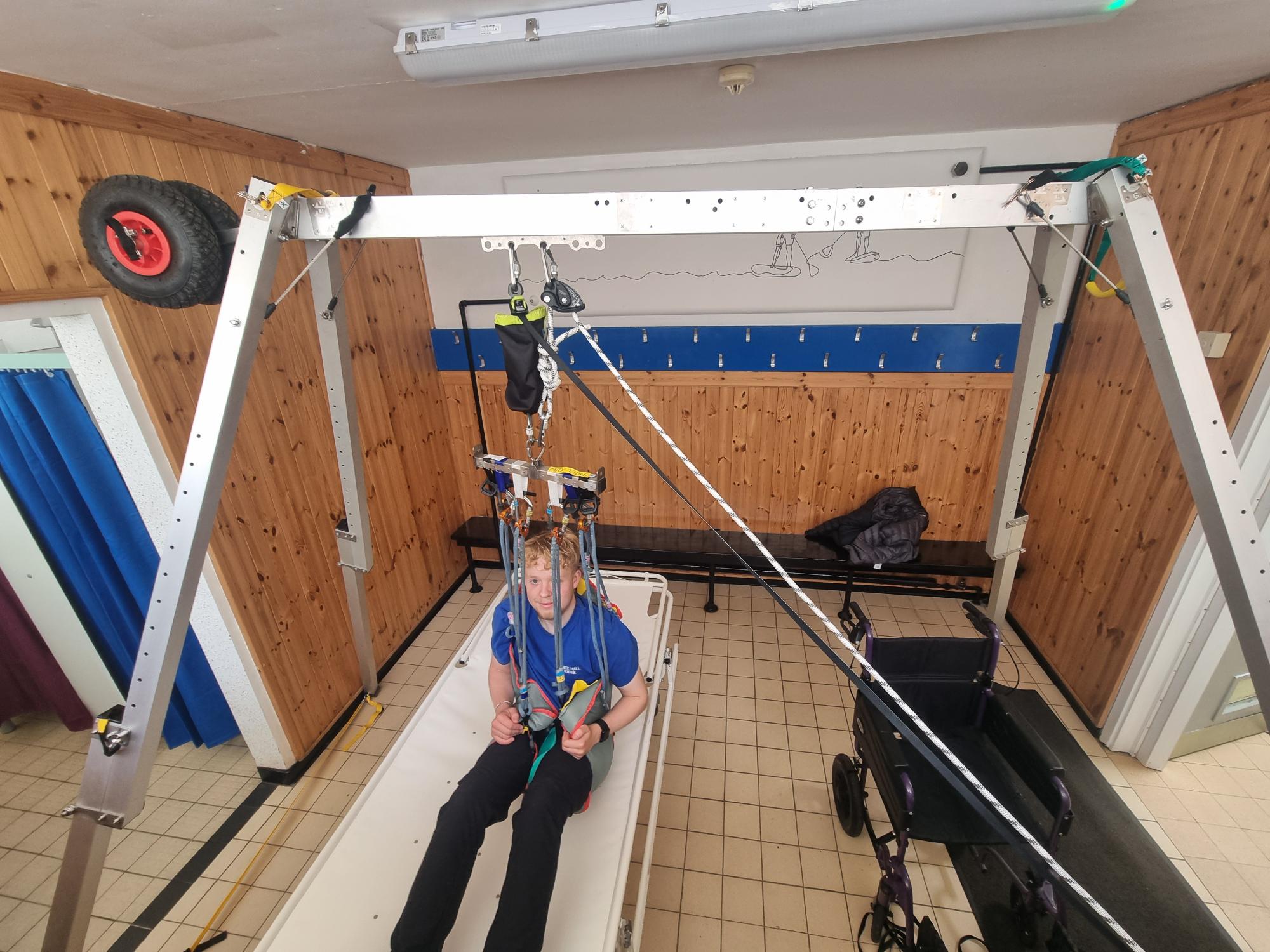 Mobile hoist with staff member